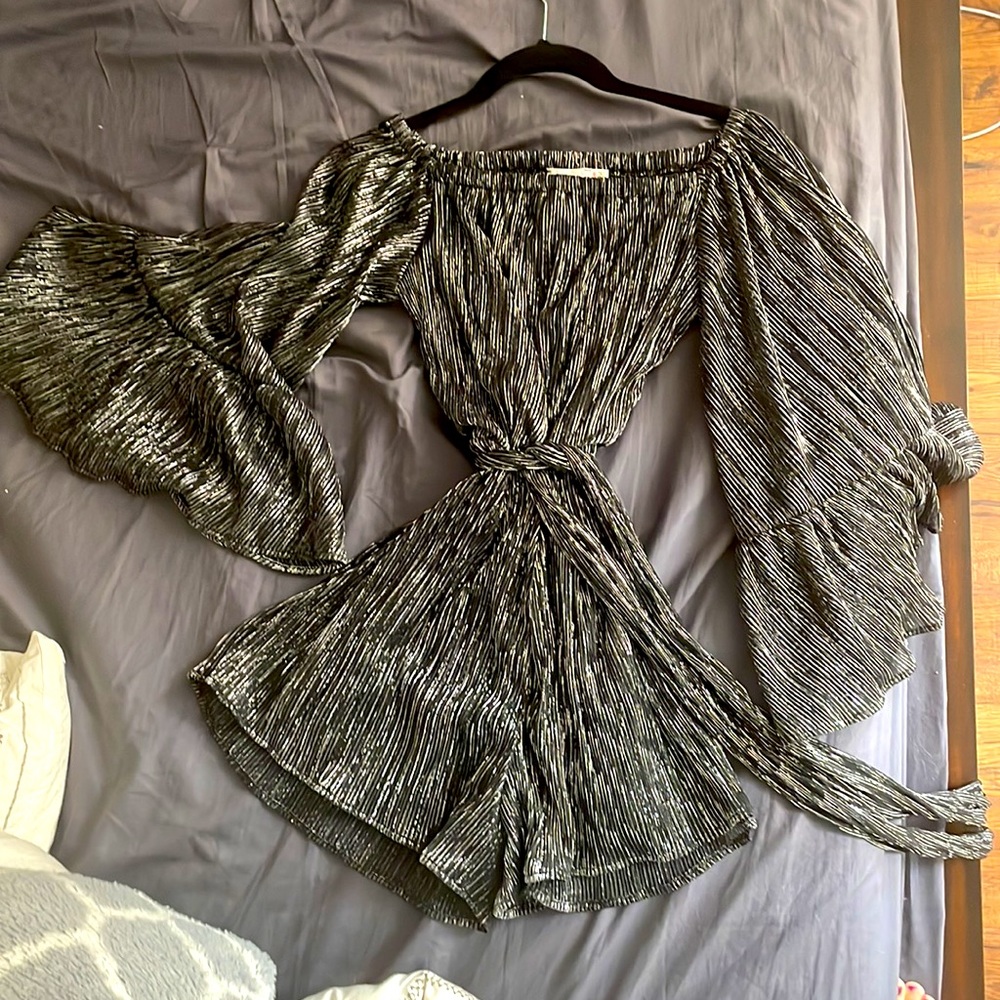 Black with silver sparkles lines, off the shoulder, short jumpsuit.